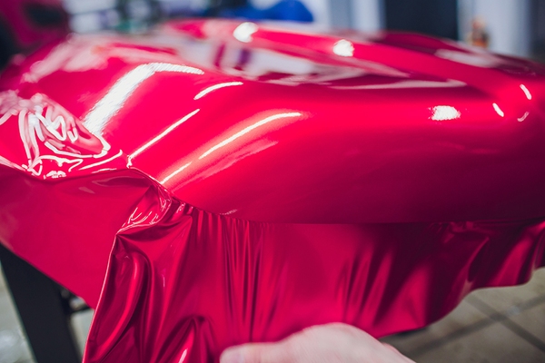 car bonnet being wrapped in red vinyl